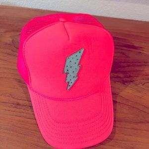 Hot pink trucker hat with lightning bolt